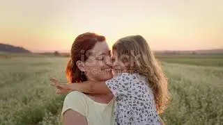 Mother and Cute Daughter Kissing | Stock Video