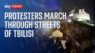 Demonstrators march through Tbilisi, Georgia, in protest over foreign agents bill