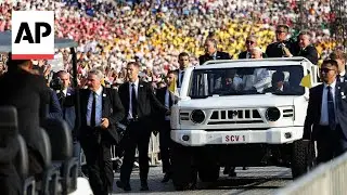 Pope Francis celebrates Mass before an estimated 100,000 people at Jakarta stadium