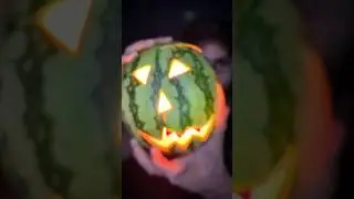 Carving a watermelon jack-o-lantern for Summerween