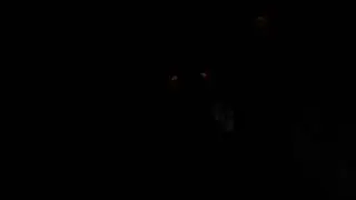 glowing eyes shadow figure