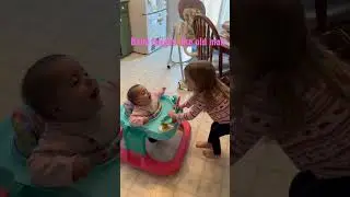 Baby laughs during sister playtime