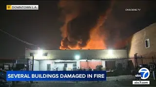 Massive fire in downtown LA destroys 2 buildings, injures firefighter