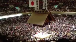 Fans throw seat cushions into ring at Ryōgoku Kokugikan