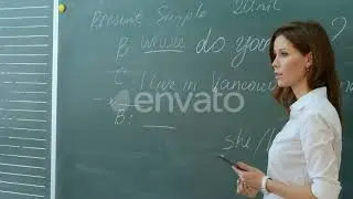 Young Female Teacher in School Classroom Talking To Class on English Lesson | Stock Footage - En...