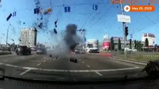 Ukraine: Dashcam video captures missile falling in Kyiv traffic