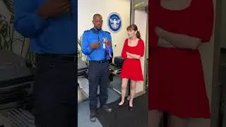 The traveler is checked by TSA as she passes via the magnetic gate! 