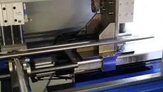 Automated bar feeder for precision cutting machine