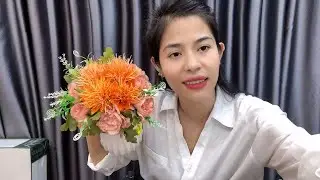 Share flower arrangements combining silk peonies and orange crystal chrysanthemums