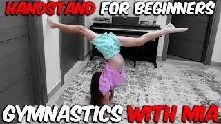 Learning how to do a hand stand in gymnastics for beginners