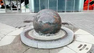 Rotating marble sphere in fountain