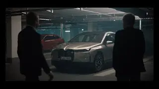 Christoph Waltz and Oliver Zipse test drive the BMW iX.