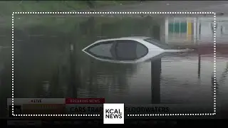 Drivers in Long Beach get stuck in floodwaters