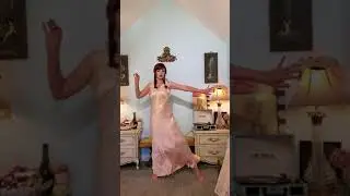 Dainty Rascal dancing in vintage silk nightgown