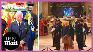 Teary-eyed King Charles III stands with coffin of Queen Elizabeth II