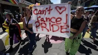 Montrealers march downtown after the Pride parade's last-minute cancelation