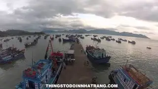 Fishing Boats being filled with ice at local fishing village near Nha Trang, Vietnam