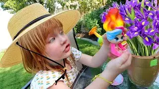 BACKYARD FLOWER SURPRiSE!!  Adley helps water the garden, petal pets, blume babies (mystery package)