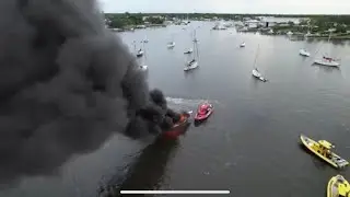 MCSO Sheriff rescuing a guy off a vessel fire, and Towboat US towing it to the fire dept 8/14/2022