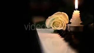 White Rose and Candle on Piano Keys - Stock Footage | VideoHive 9638531
