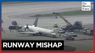 Aerials show Delta jet with damaged tail after taxiing accident