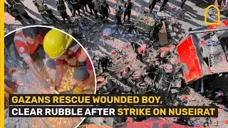 GAZANS RESCUE WOUNDED BOY, CLEAR RUBBLE AFTER STRIKE ON NUSEIRAT