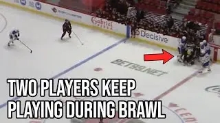 Hockey players go one on one while their teammates fight, a breakdown