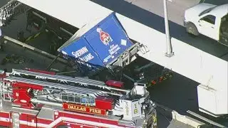 Dramatic helicopter video shows emergency crews rescue driver from truck hanging off the highway