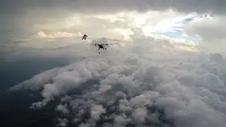 Wingsuit Flying Down a Cloud Canyon Over Chicago