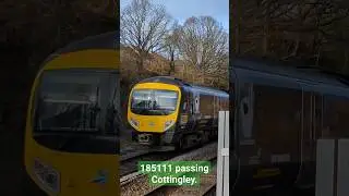 185111 passing Cottingley at speed.