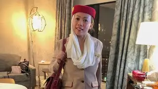 My mommy pretending to be an Emirates flight attendant!