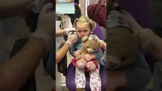 3 year old getting ears pierced at Claire's accessories