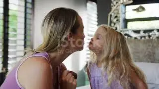 Cute Daughter Kisses Mommy | Stock Video