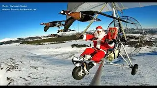 Le Père Noël vole avec les oiseaux. Conseil paramètres lecture 720p. Santa Claus flies with birds.