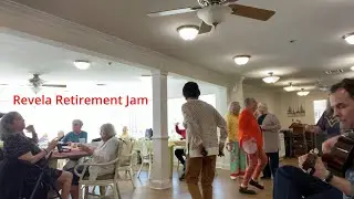 Jam session at a retirement center with guitar, castanets and tamborines.