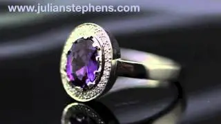 Handmade platinum and purple sapphire engagement ring