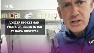 UNICEF spokesman James Elder visits a Palestinian child at the ICU in a Gaza hospital