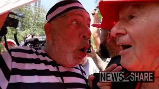 Anti-Trump protester - later arrested blocking motorcade - vs MAGA outside Miami Trump arraignment