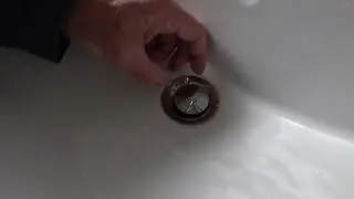 How to clear the wash basin pop up waste. No tools required.