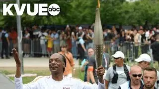 Snoop Dogg carries Olympic torch before Opening Ceremony in Paris