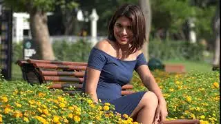 Smiling Female Teen Sitting In Park