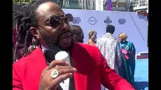 Raheem DeVaughn reveals his favorite new artists on the 2024 BET Awards red carpet