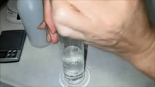 Testing of isopropyl alcohol percentage using graduated cylinder and scale