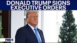 President Donald Trump signs Executive Order