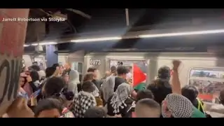 Protestors chant raise your hand if you are a Zionist on NYC subway