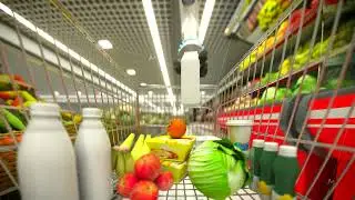 Hand robot buys food and puts them in the basket. 4k