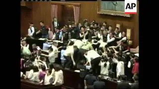 Pro-and anti-government lawmakers in Taiwan exchanged punches and threw rubbish bins at each other o