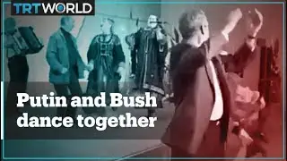 Archive footage shows Putin and Bush dancing together