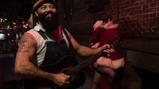 Rev. Peyton serenades drunken Santa's making out in the street