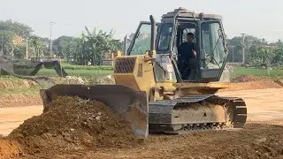 Bulldozers are leveling the ground on the construction site